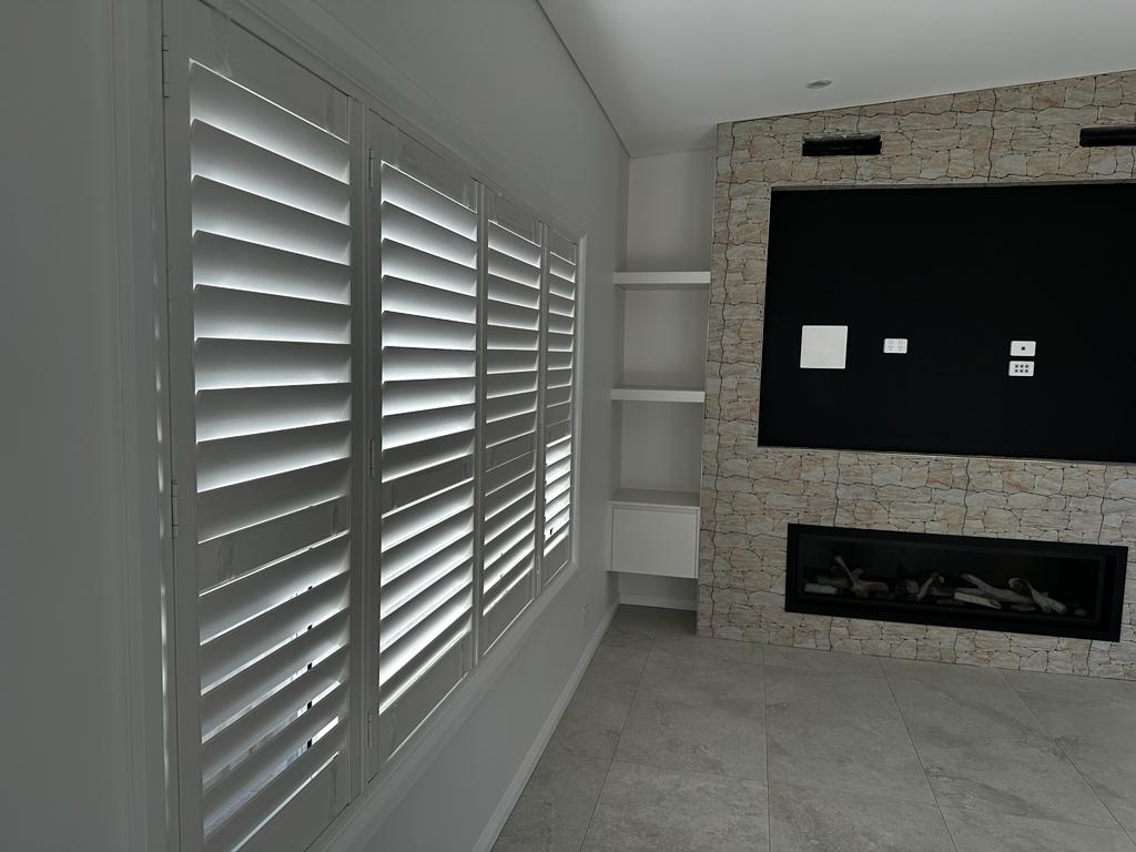 Blinds Curtains Outlet design consultant measuring a window for custom blinds in Sydney